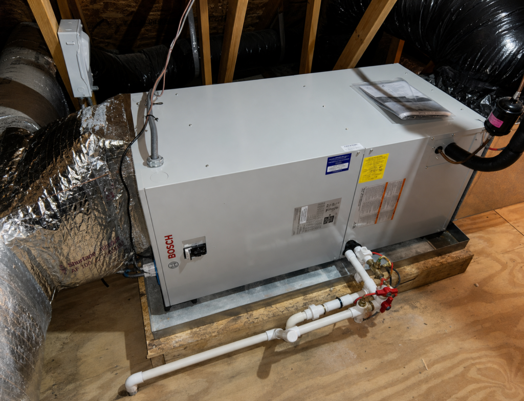Bosch indoor air handler installation in the attic at the same Auburndale residential project.