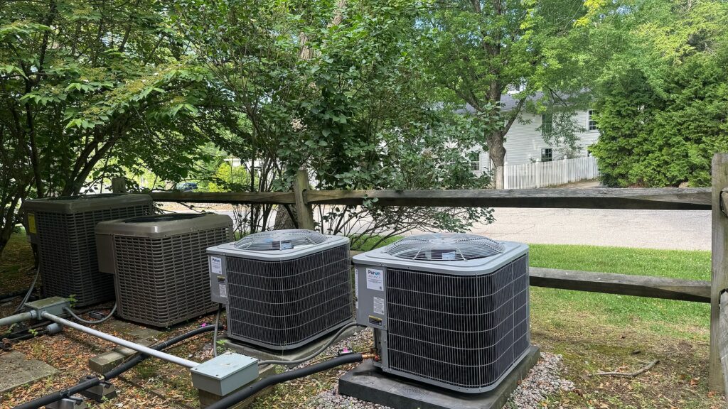 Heat pump condenser equipment and line-set routing at Dunstable Town Hall.